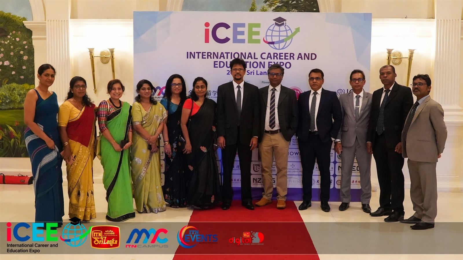 Guests and the organising team at the ICEE backdrop.